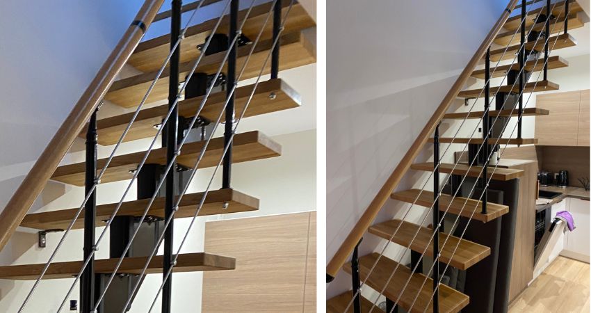 DUBAI stepenice – dizajn koji povezuje etaže s lakoćom i stilom modularno stubište DUBAI s masivnim drvenim gazištima, crnom metalnom konstrukcijom i kosim čeličnim sajlama u modernoj kuhinji