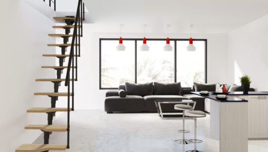 unutarnje stepenice s crnom metalnom konstrukcijom i drvenim gazištima u modernom dnevnom boravku